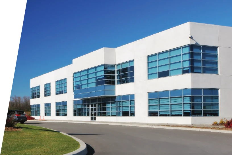 Two story office building with clean, blue tinted windows.